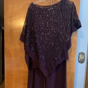 Slacks  with chemise top and poncho cover.